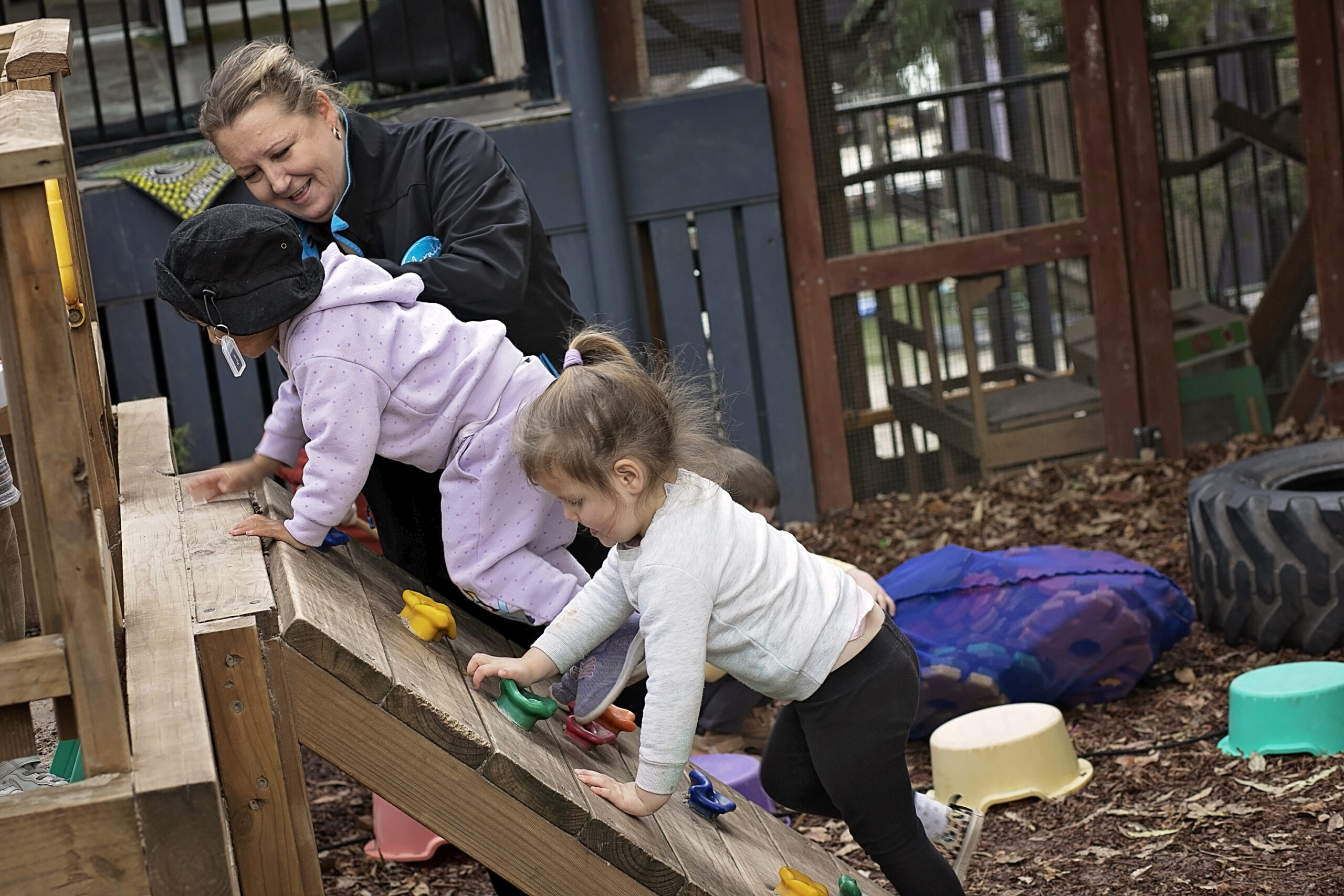 Meraki Mooroolbark — educator with children climbing outdoors